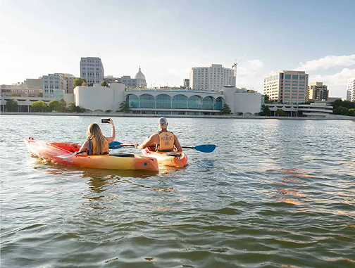 Kayakers with the Wisconsin State Capitol in the distance